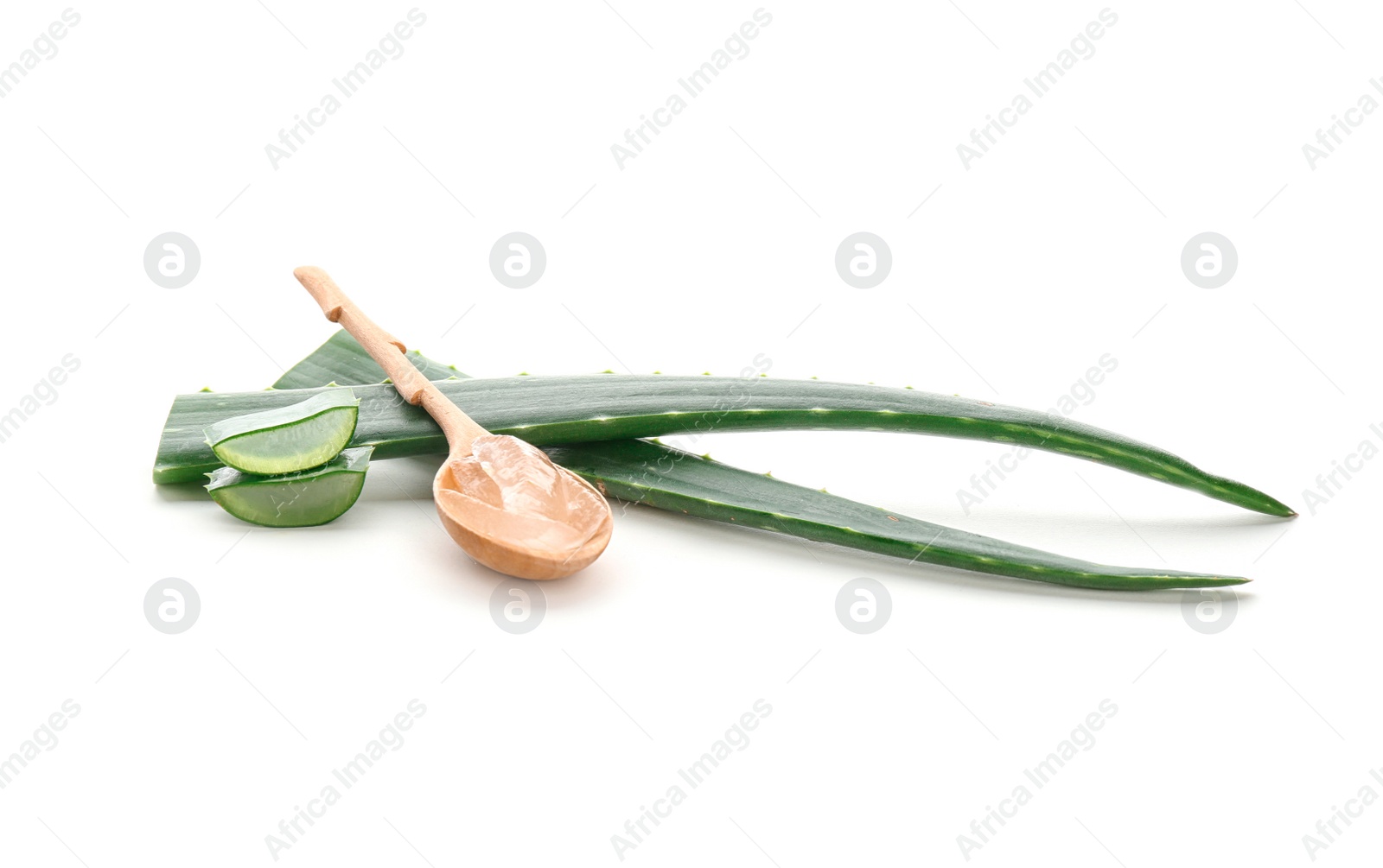 Photo of Wooden spoon with aloe vera gel and green leaves on white background