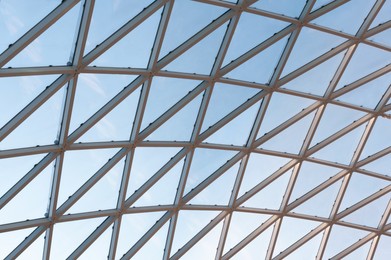 Photo of Low angle view of glass ceiling as background