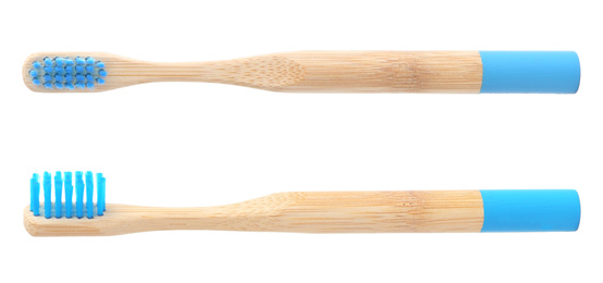 Image of Bamboo toothbrushes with blue bristles on white background 