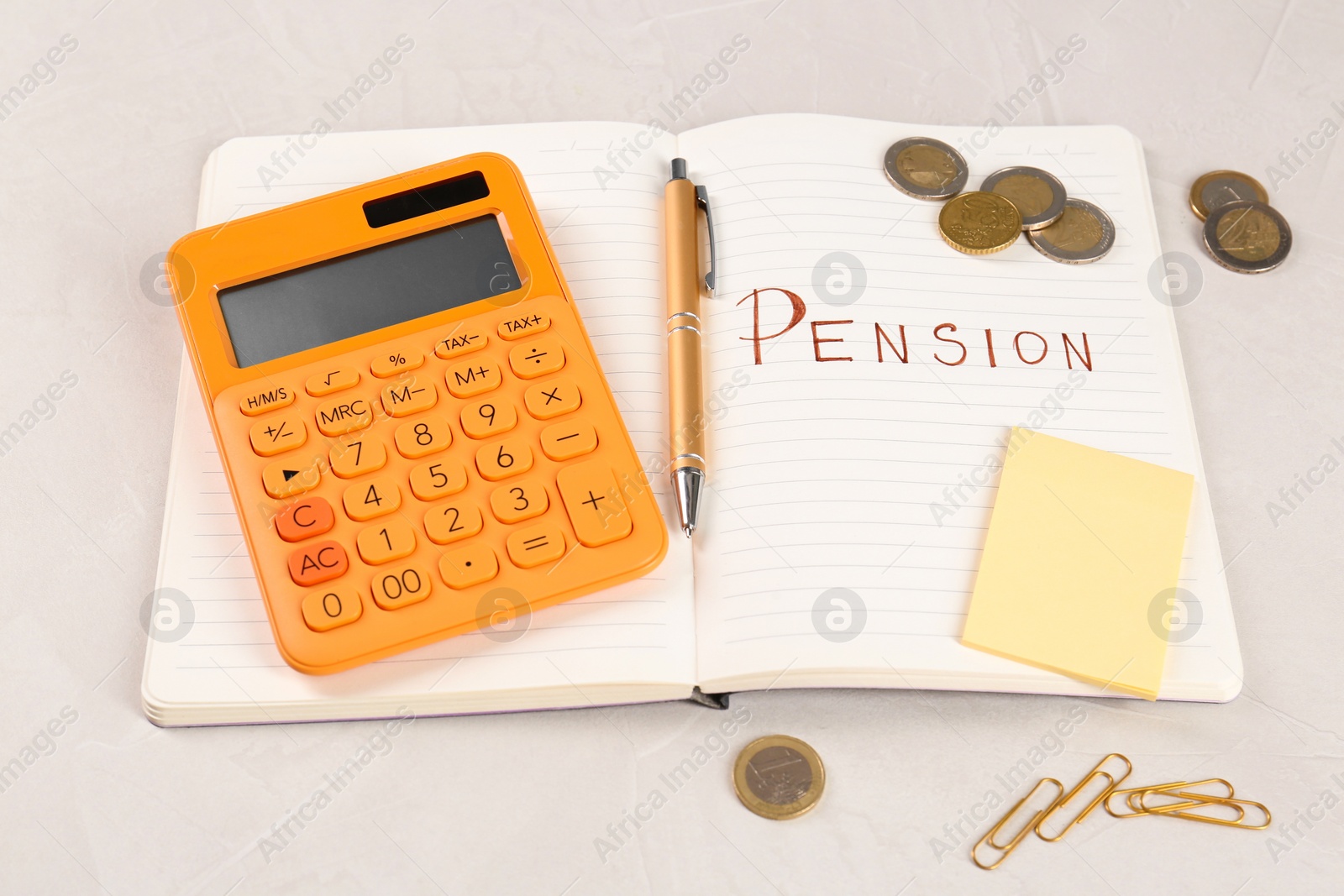 Photo of Calculator, notebook with word Pension, pen, coins, sticky note and paper clips on light gray table. Retirement concept