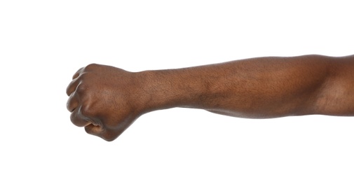 African-American man showing fist on white background, closeup