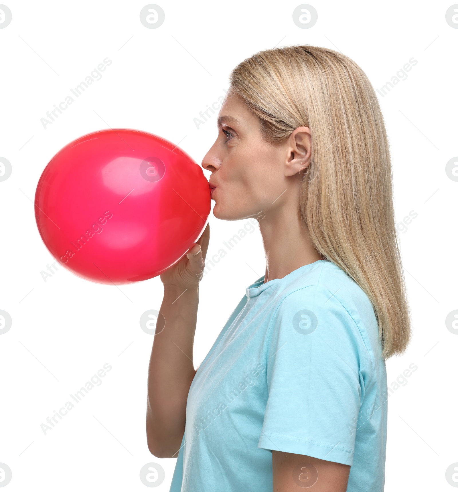 Photo of Woman blowing up balloon on white background