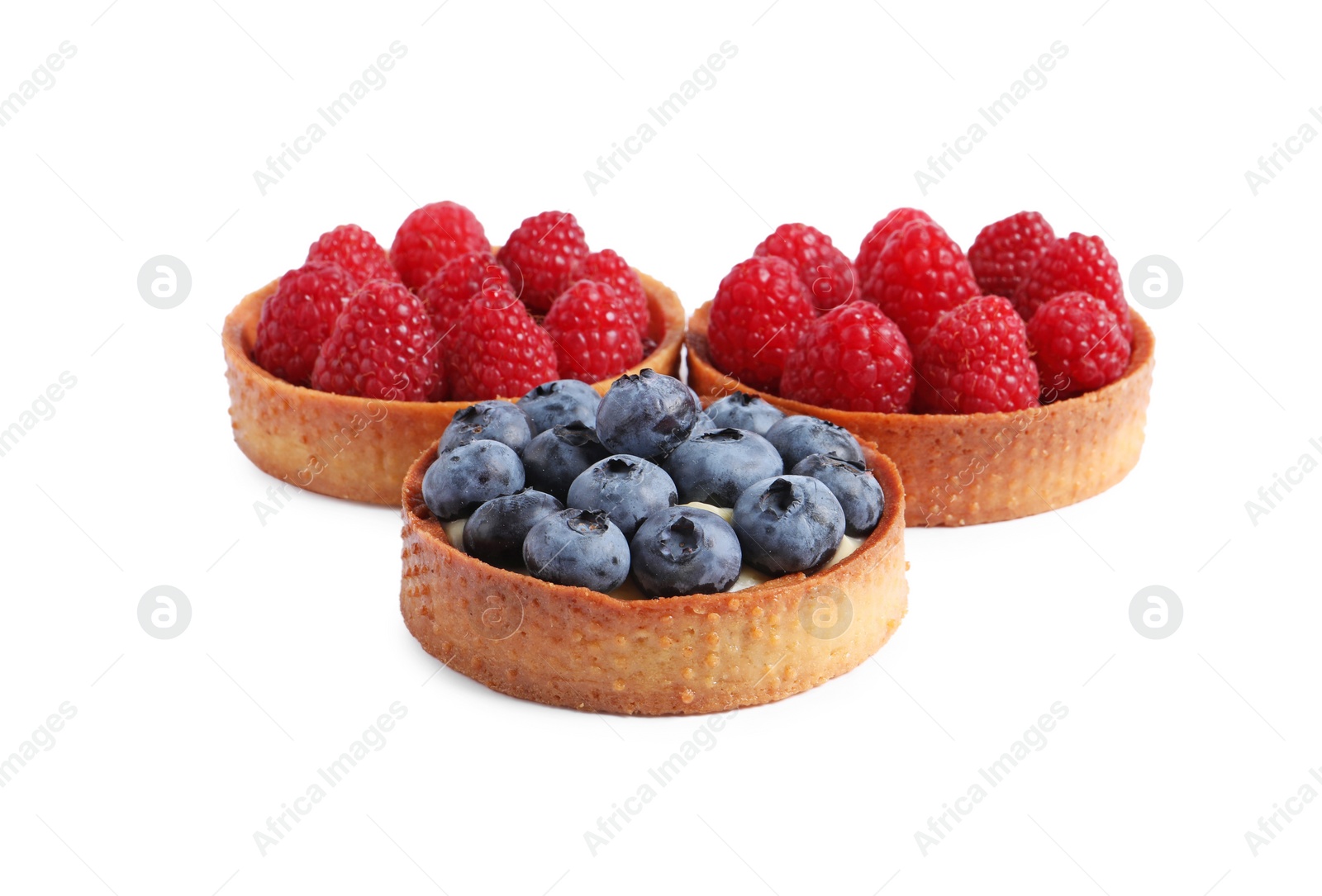 Photo of Tartlets with different fresh berries isolated on white. Delicious dessert