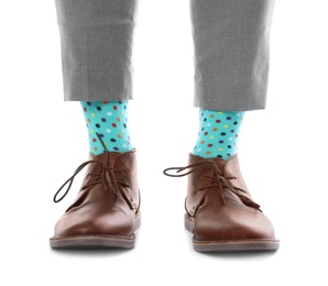 Man wearing stylish socks and shoes on white background, closeup