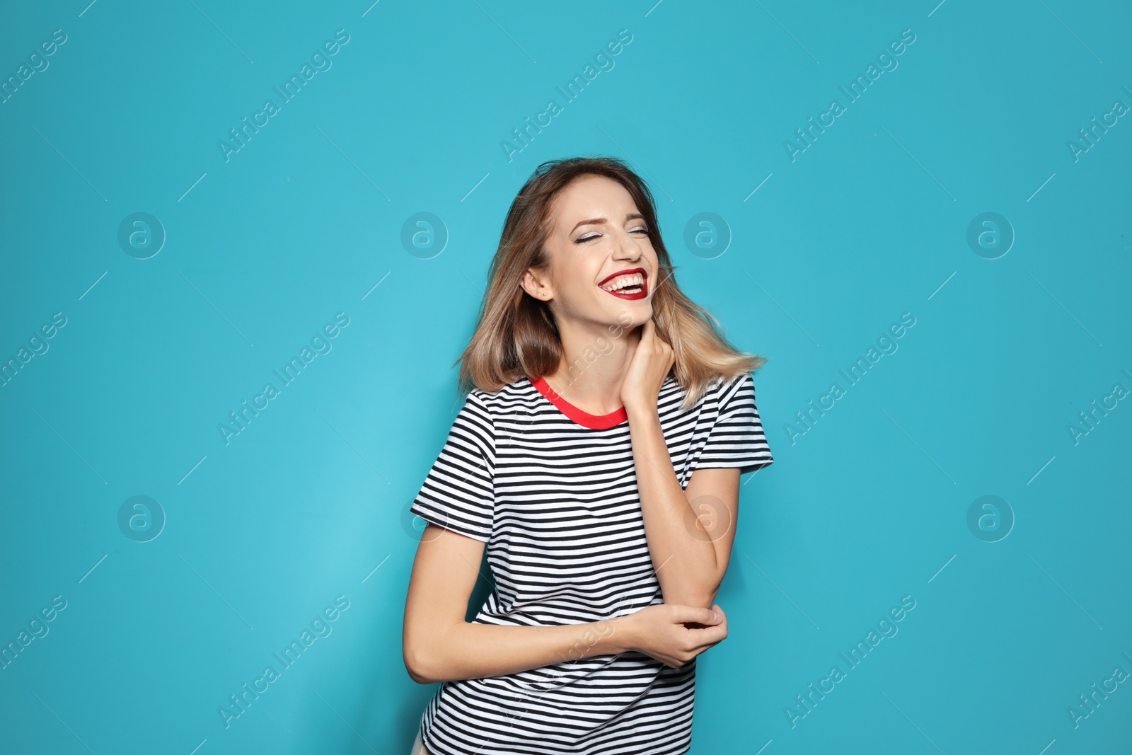 Photo of Beautiful young woman with healthy long blonde hair on color background