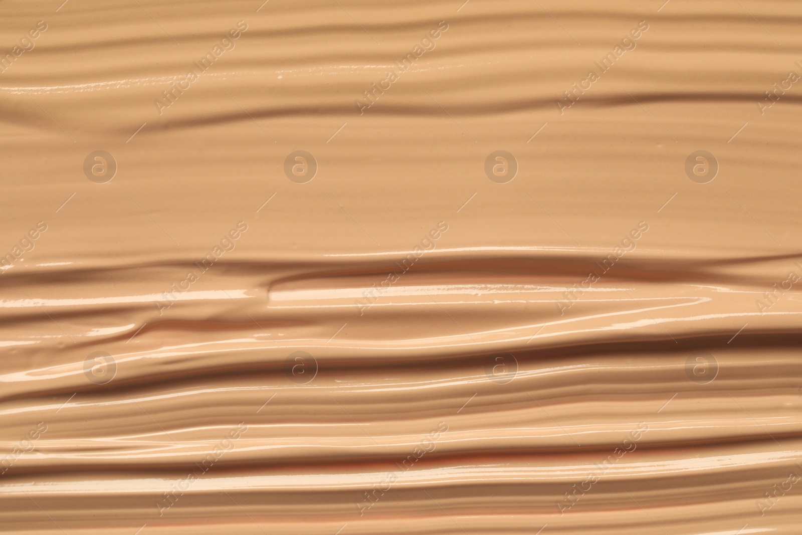 Photo of Texture of liquid skin foundation as background, closeup