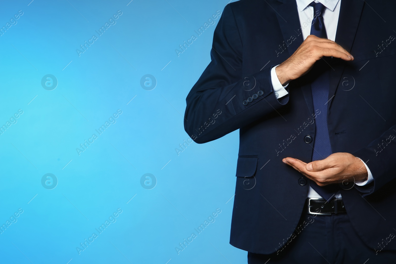Photo of Businessman holding something on color background, closeup view of hands with space for text