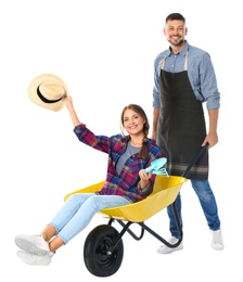 Couple of gardeners with wheelbarrow on white background
