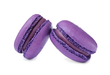 Photo of Purple macarons on white background. Delicious dessert