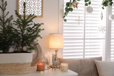 Photo of Beautiful room interior decorated for Christmas with potted firs