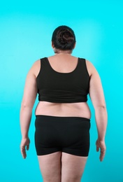 Photo of Fat woman on color background. Weight loss