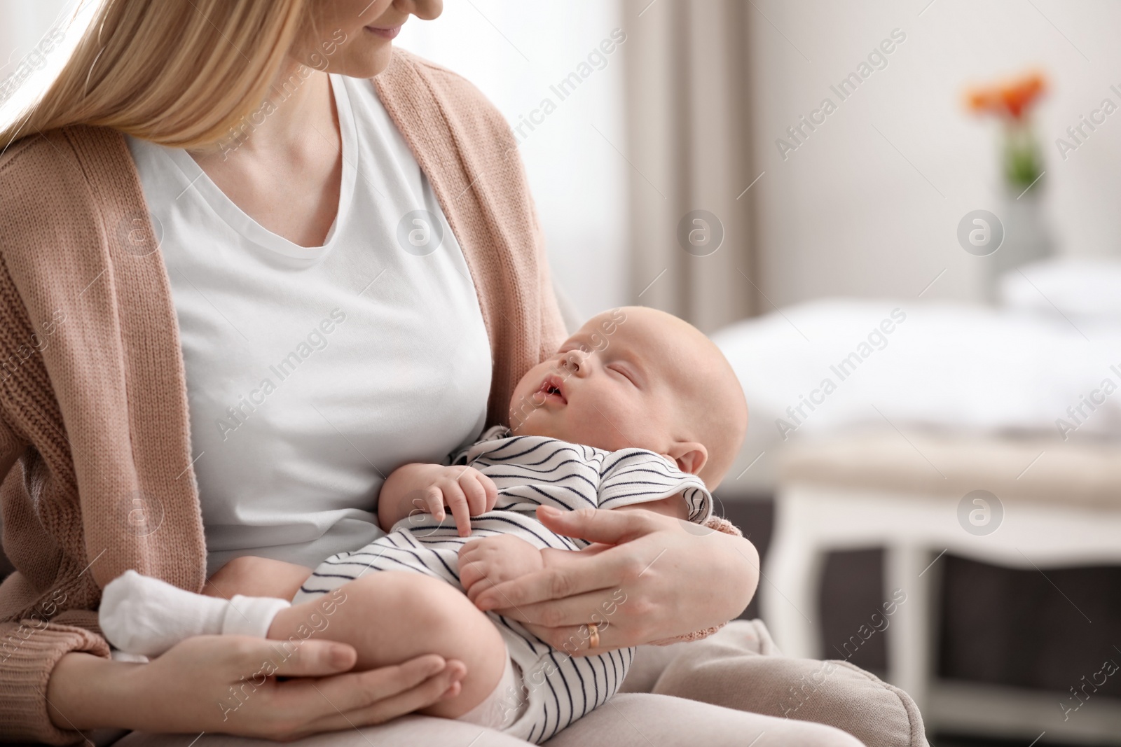 Photo of Mother with her little baby at home