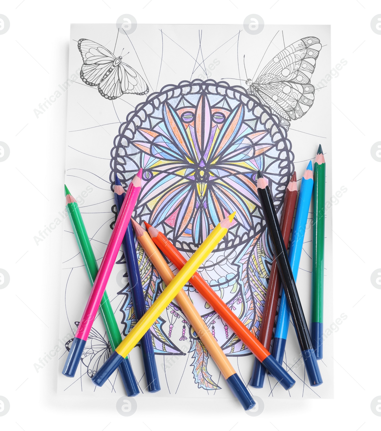 Photo of Antistress coloring page and pencils on white background, top view