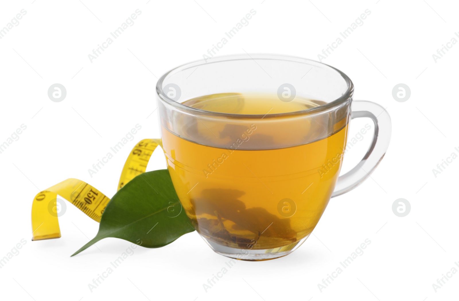 Photo of Glass cup of diet herbal tea, measuring tape and fresh leaf on white background. Weight loss