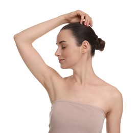 Photo of Beautiful woman showing armpit with smooth clean skin on white background