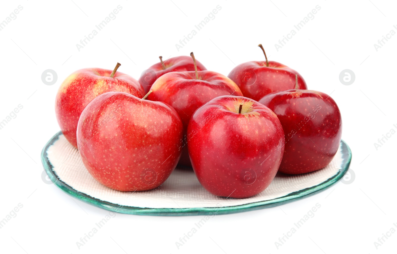 Photo of Plate of ripe juicy red apples on white background