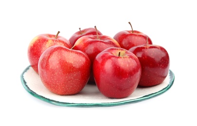 Photo of Plate of ripe juicy red apples on white background