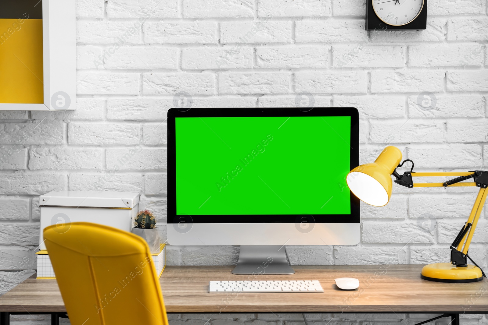 Image of Computer display with chroma key on desk in room. Comfortable workplace