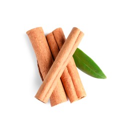 Photo of Cinnamon sticks and green leaf isolated on white, top view