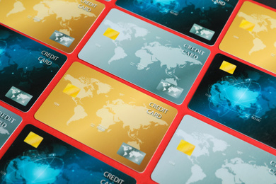 Different plastic credit cards on red background
