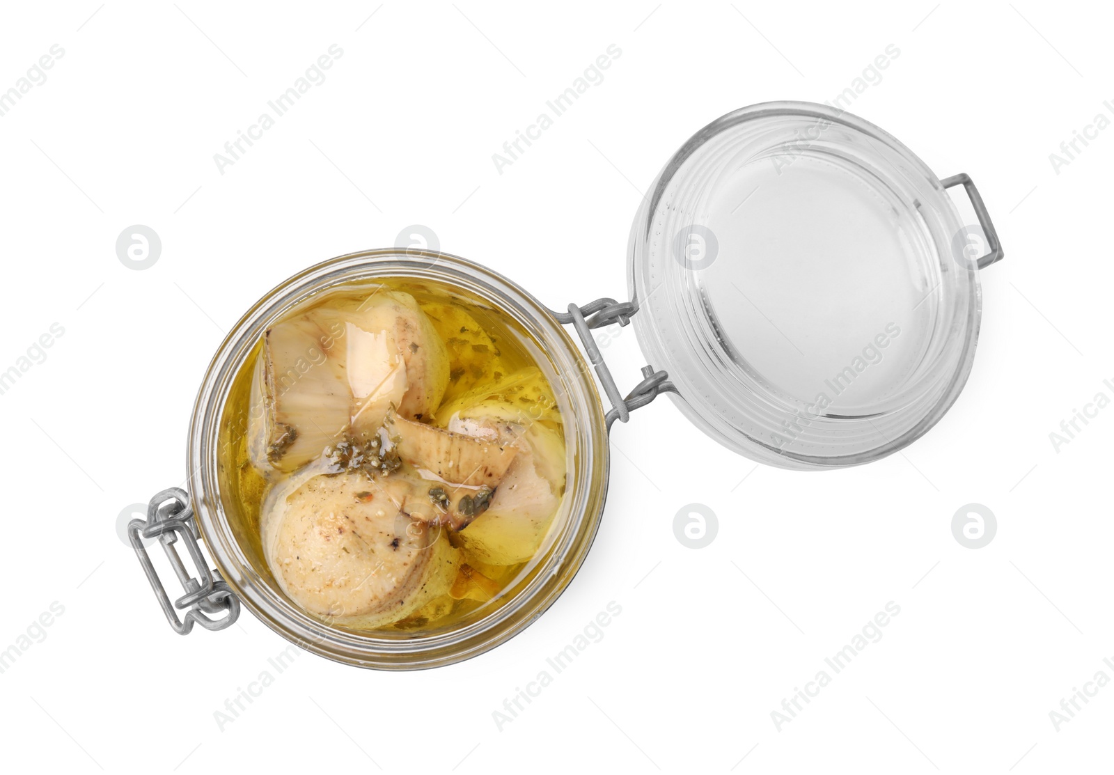 Photo of Open jar of delicious artichokes pickled in olive oil isolated on white, top view