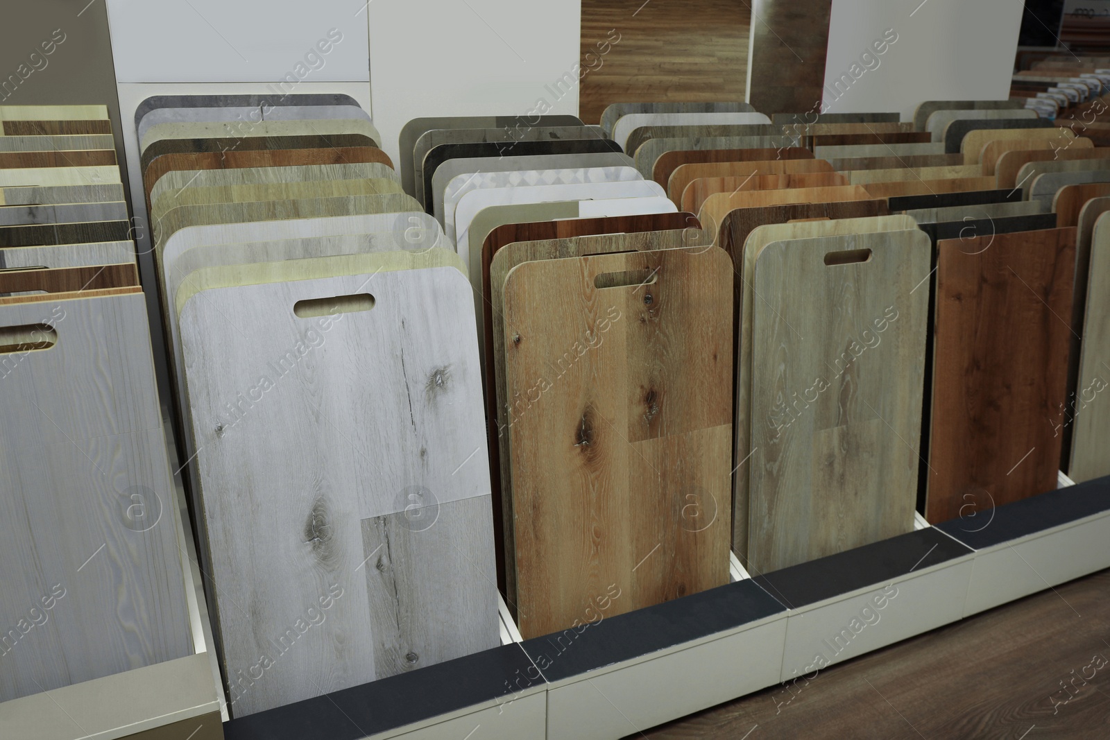 Photo of Many different samples of wooden flooring in store