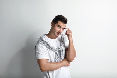 Portrait of handsome young man on white background