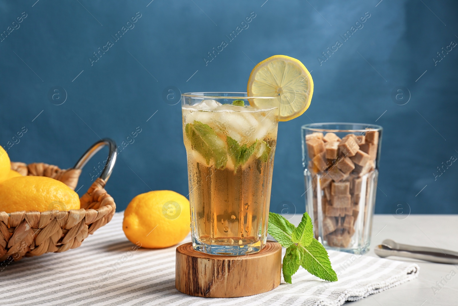 Photo of Glass of delicious mint julep cocktail on table