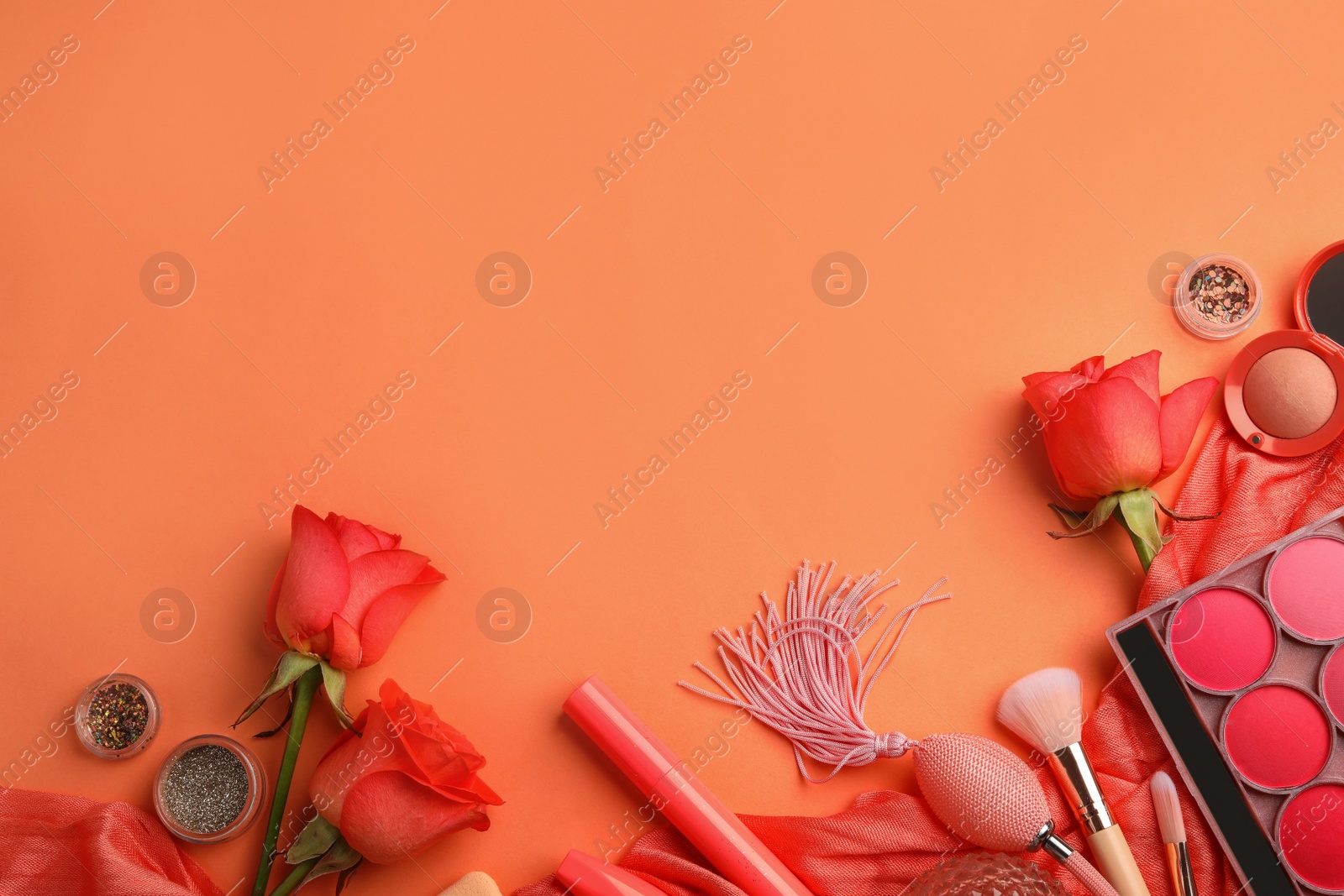 Photo of Flat lay composition with coral beauty accessories and roses on color background. Space for text