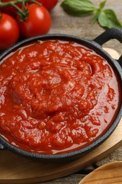 Photo of Homemade tomato sauce in bowl on table, closeup