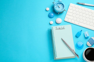 Photo of Flat lay composition with unfilled To Do list, computer keyboard and cup of coffee on light blue background. Space for text