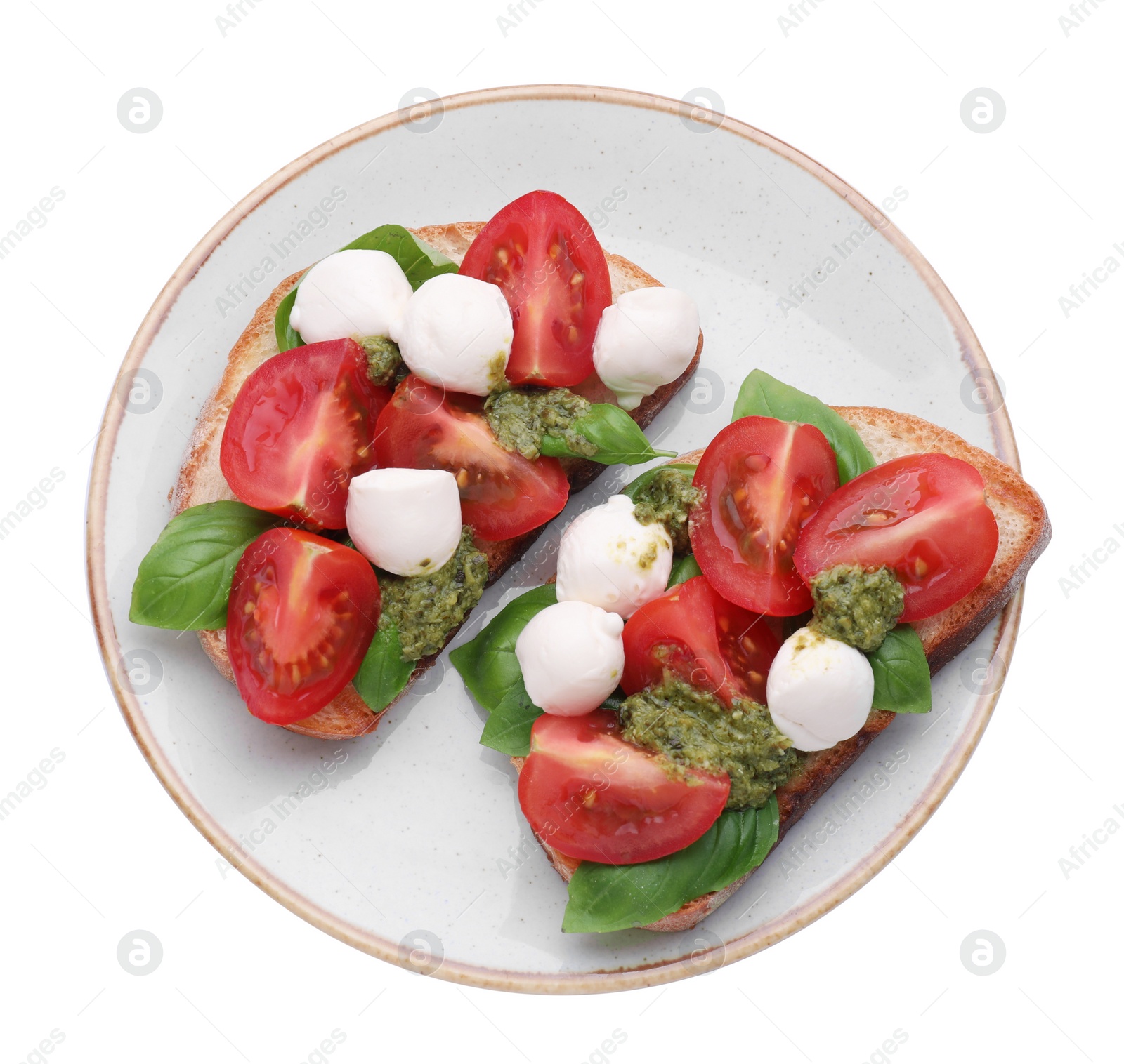 Photo of Delicious Caprese sandwiches with mozzarella, tomatoes, basil and pesto sauce isolated on white, top view