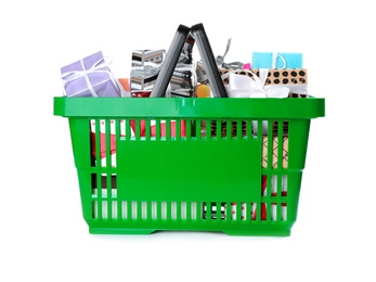 Green shopping basket with different gifts on white background