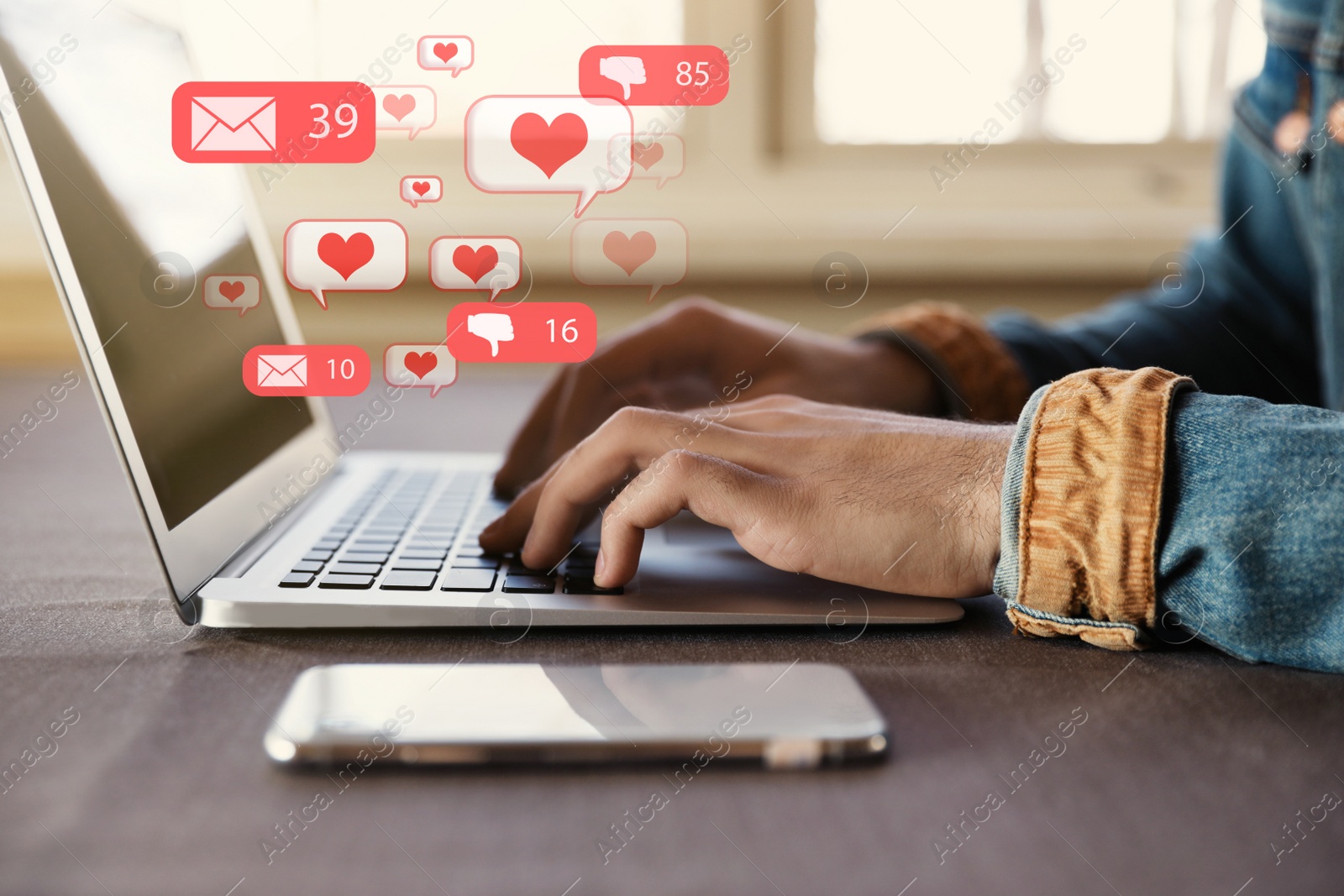 Image of Young man using laptop at table in cafe, closeup. Social media