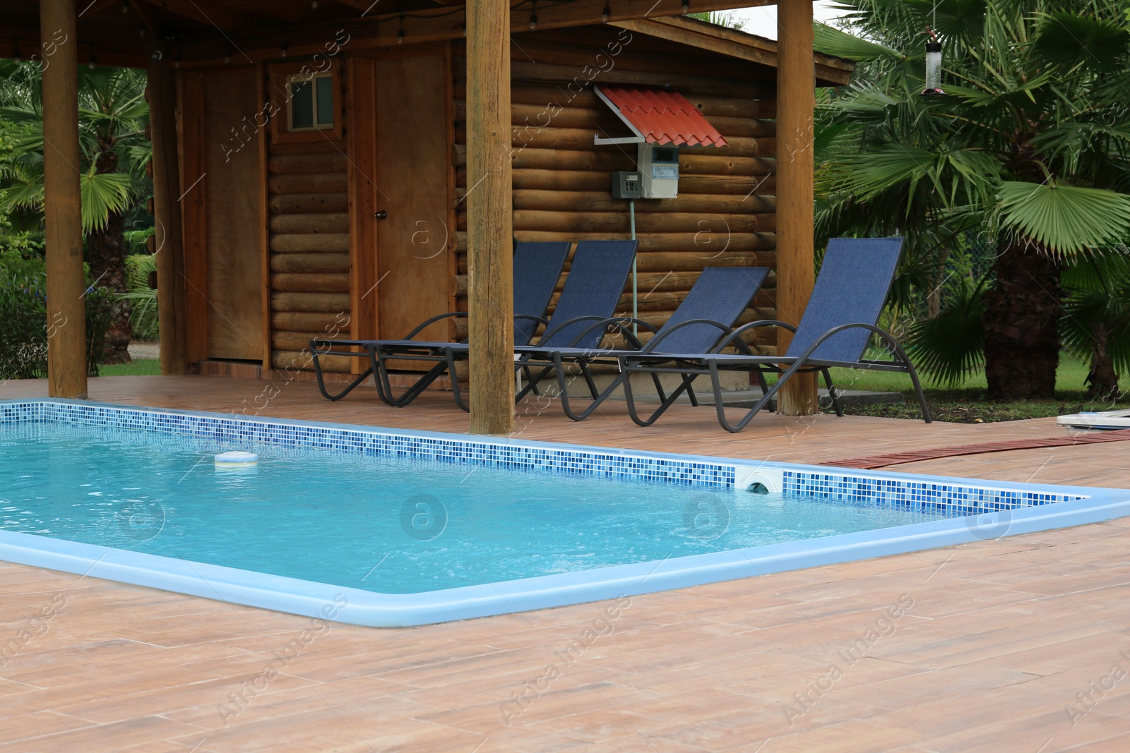 Photo of Outdoor swimming pool with clear water at resort