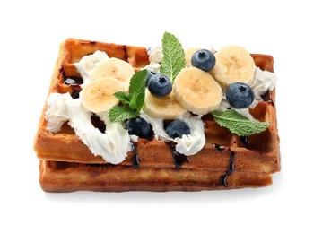 Photo of Delicious Belgian waffles with blueberry, banana, whipped cream and chocolate sauce isolated on white