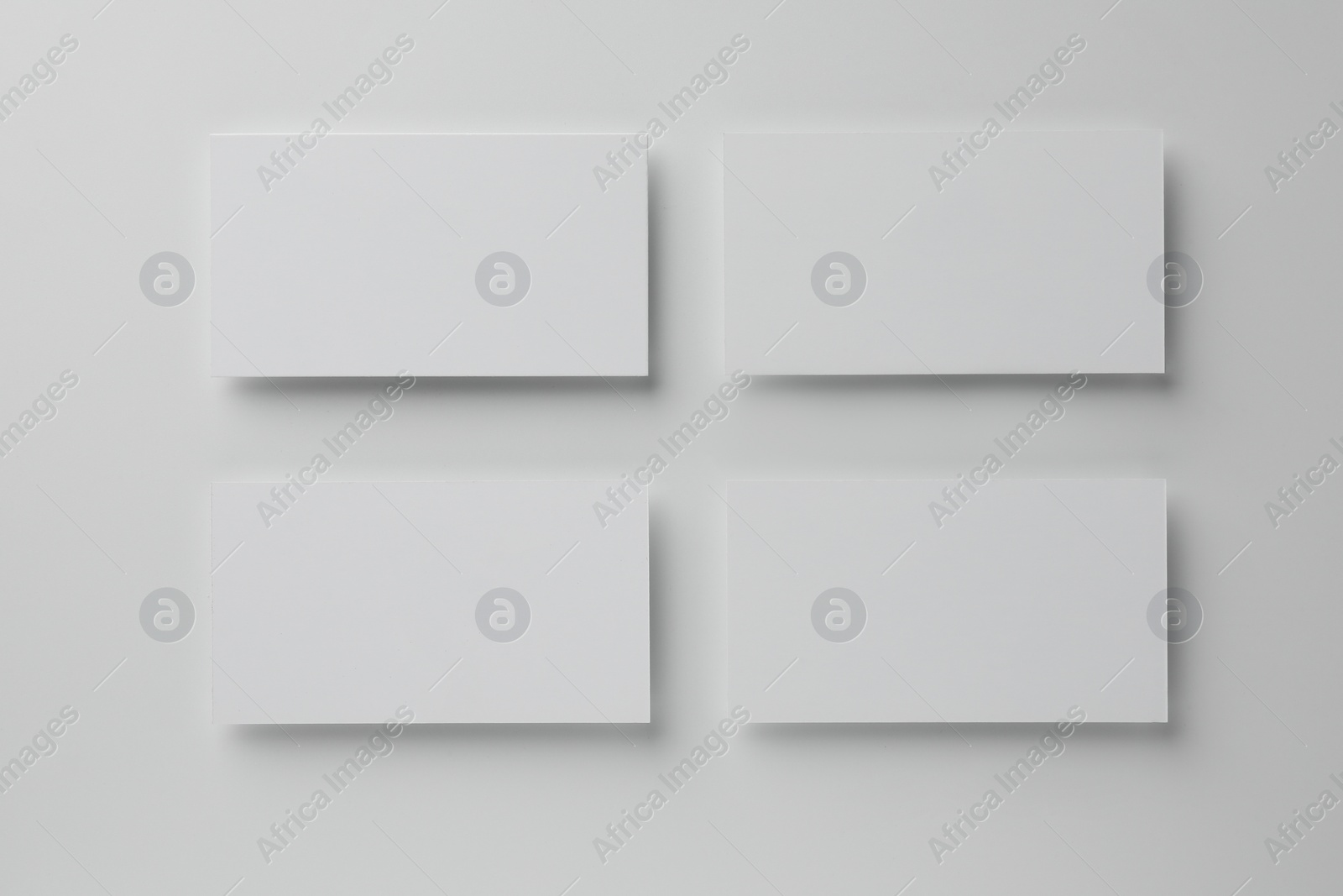 Photo of Blank business cards on white background, top view. Mockup for design