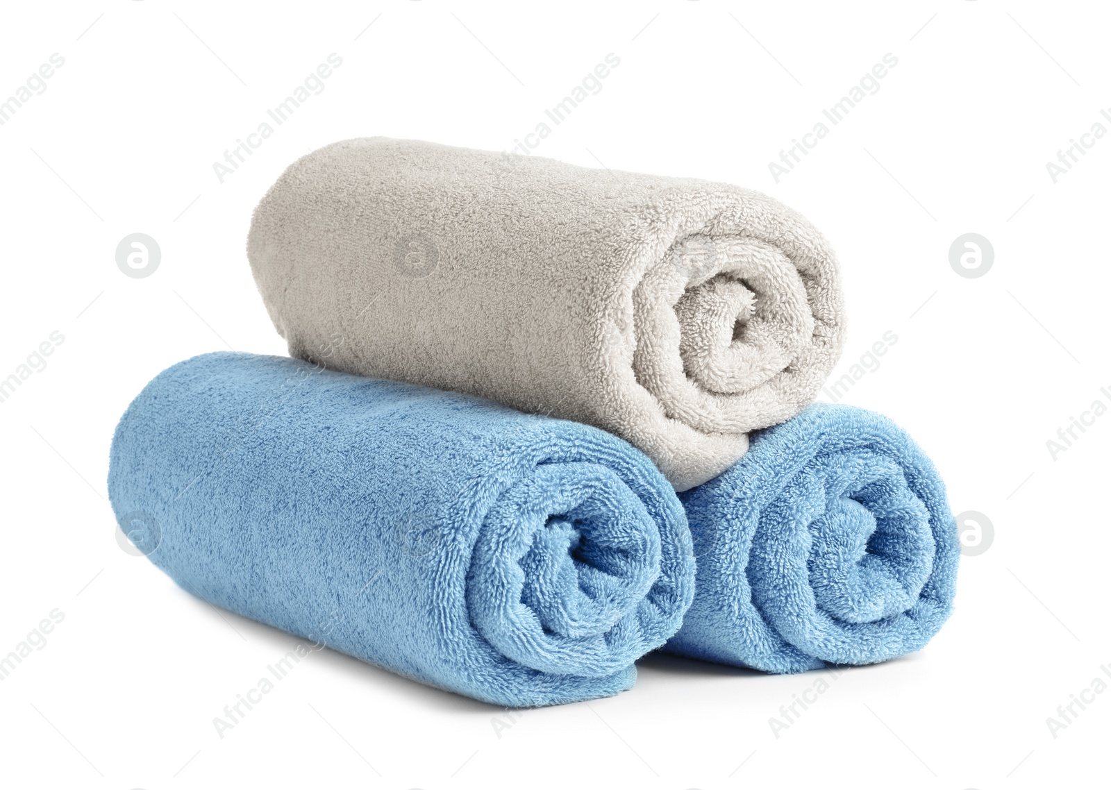 Photo of Rolled soft terry towels on white background