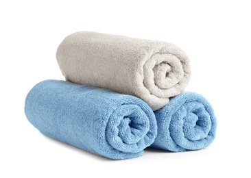 Photo of Rolled soft terry towels on white background