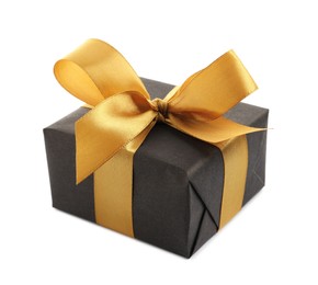 Photo of Black gift box with golden bow on white background