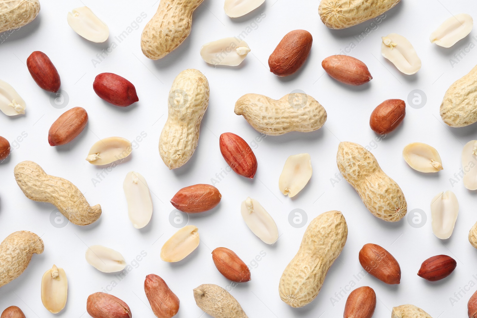 Photo of Fresh peanuts on white background, flat lay