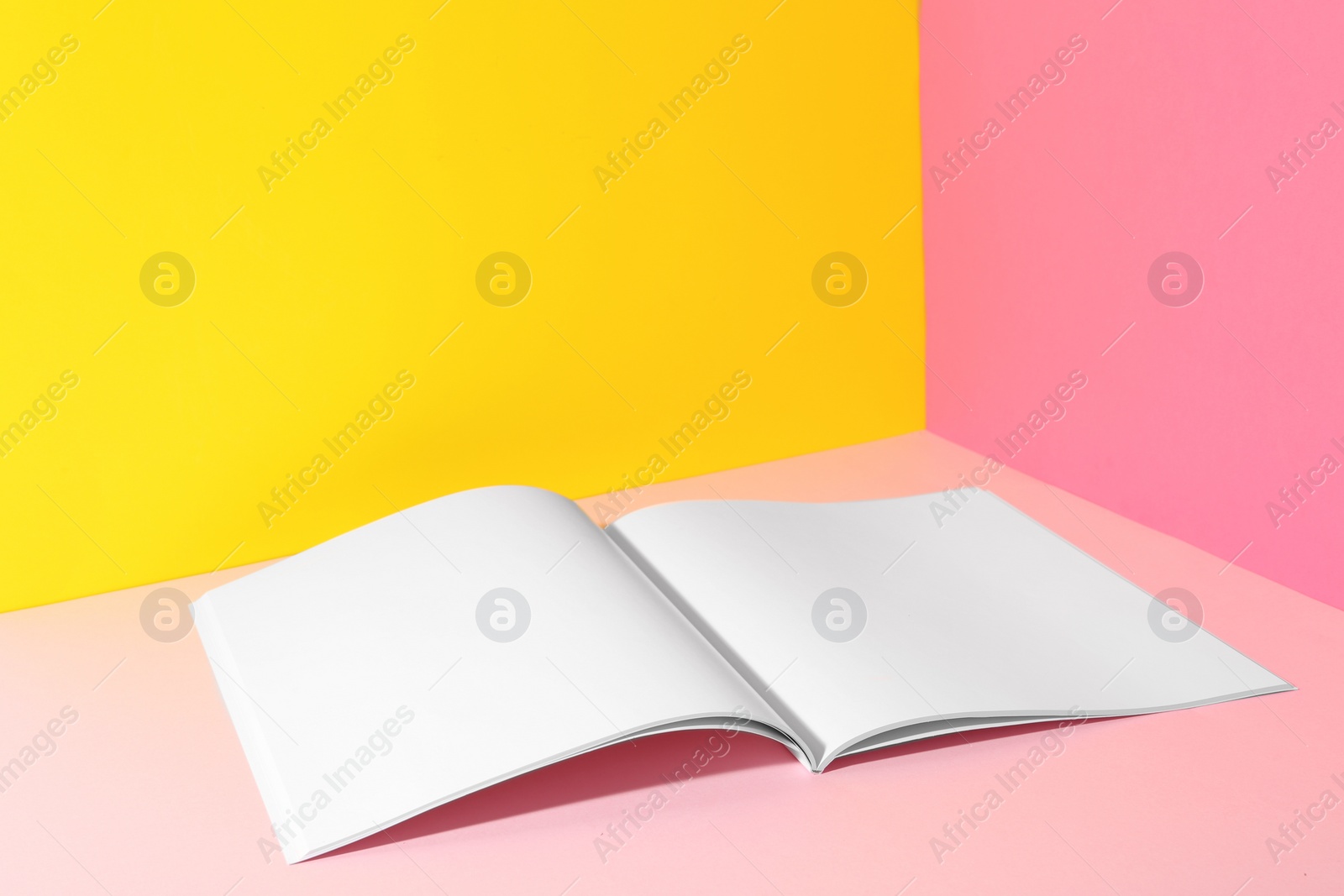 Photo of Empty book pages on color background. Mockup for design