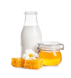 Photo of Beautiful composition with milk and honey on white background