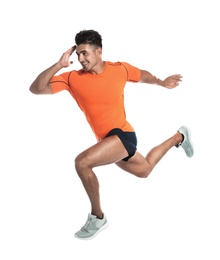 Photo of Handsome young man running on white background