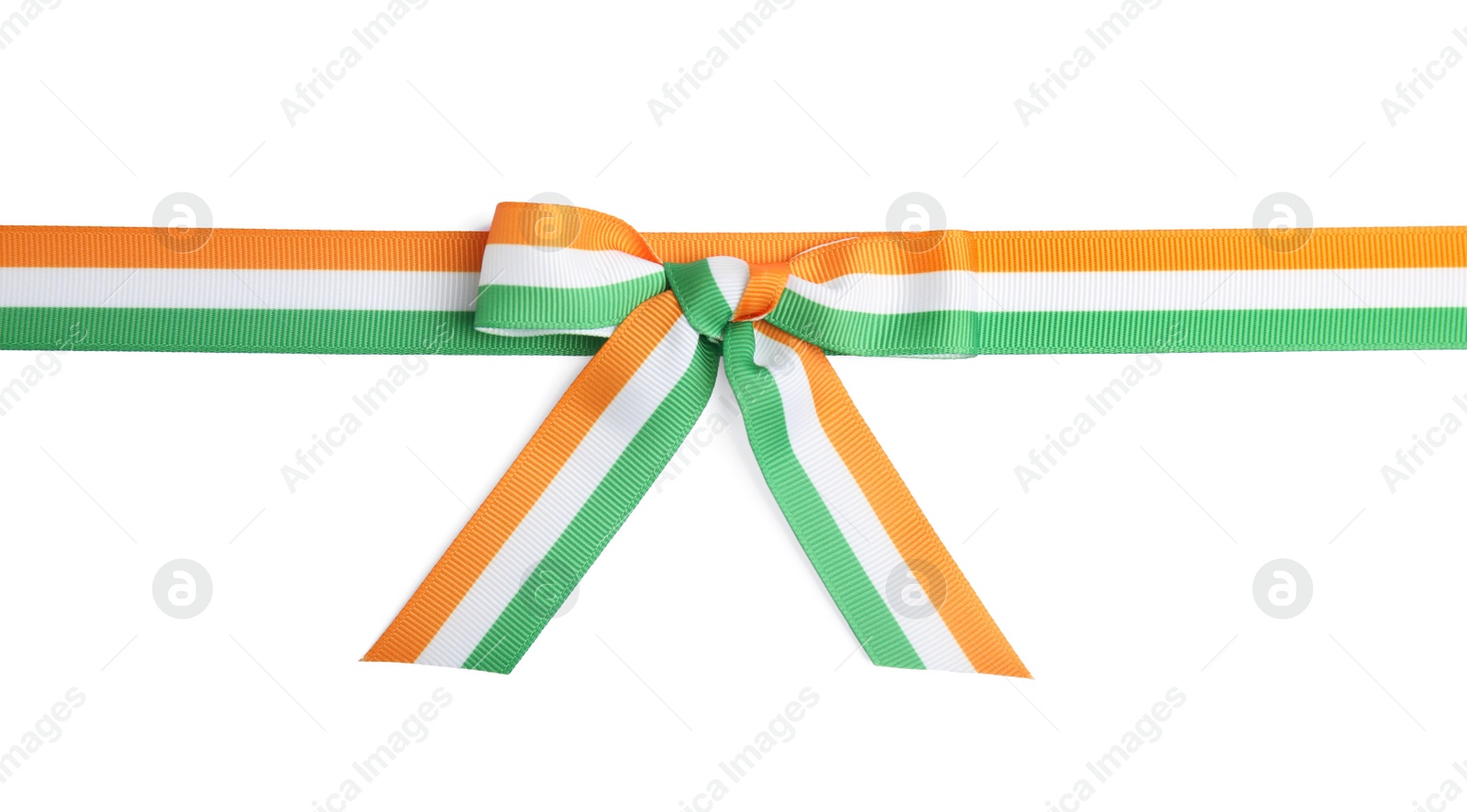 Photo of Indian flag ribbon with bow on white background, top view