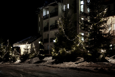 Beautiful modern hotel at night. Winter vacation