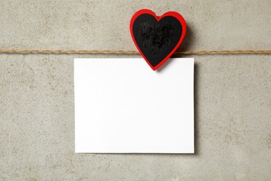 Blank card on grey background, top view with space for text. Valentine's Day celebration