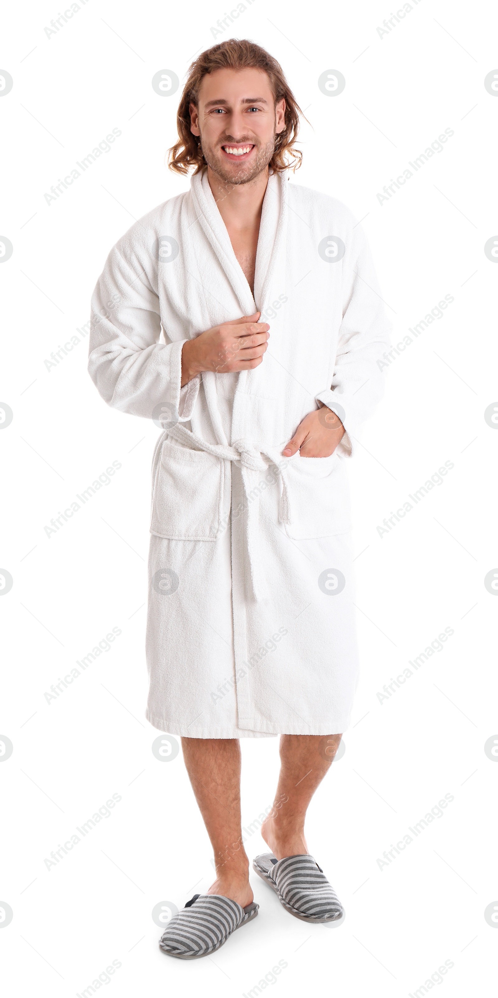 Photo of Young man in bathrobe on white background