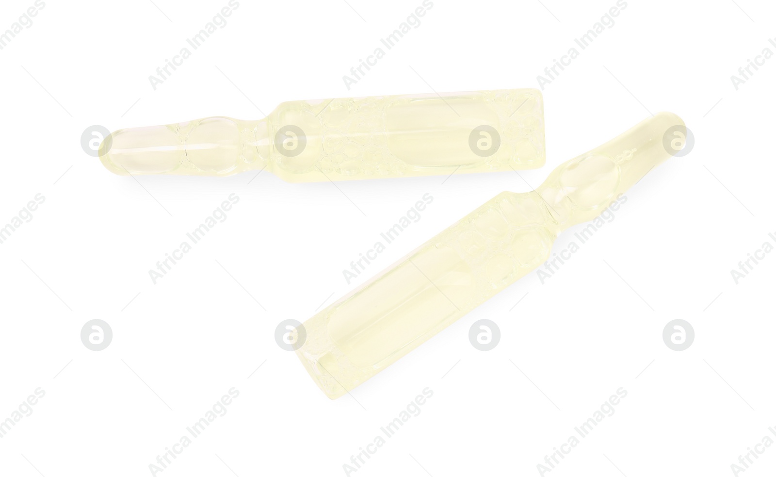 Photo of Glass ampoules with liquid isolated on white, top view