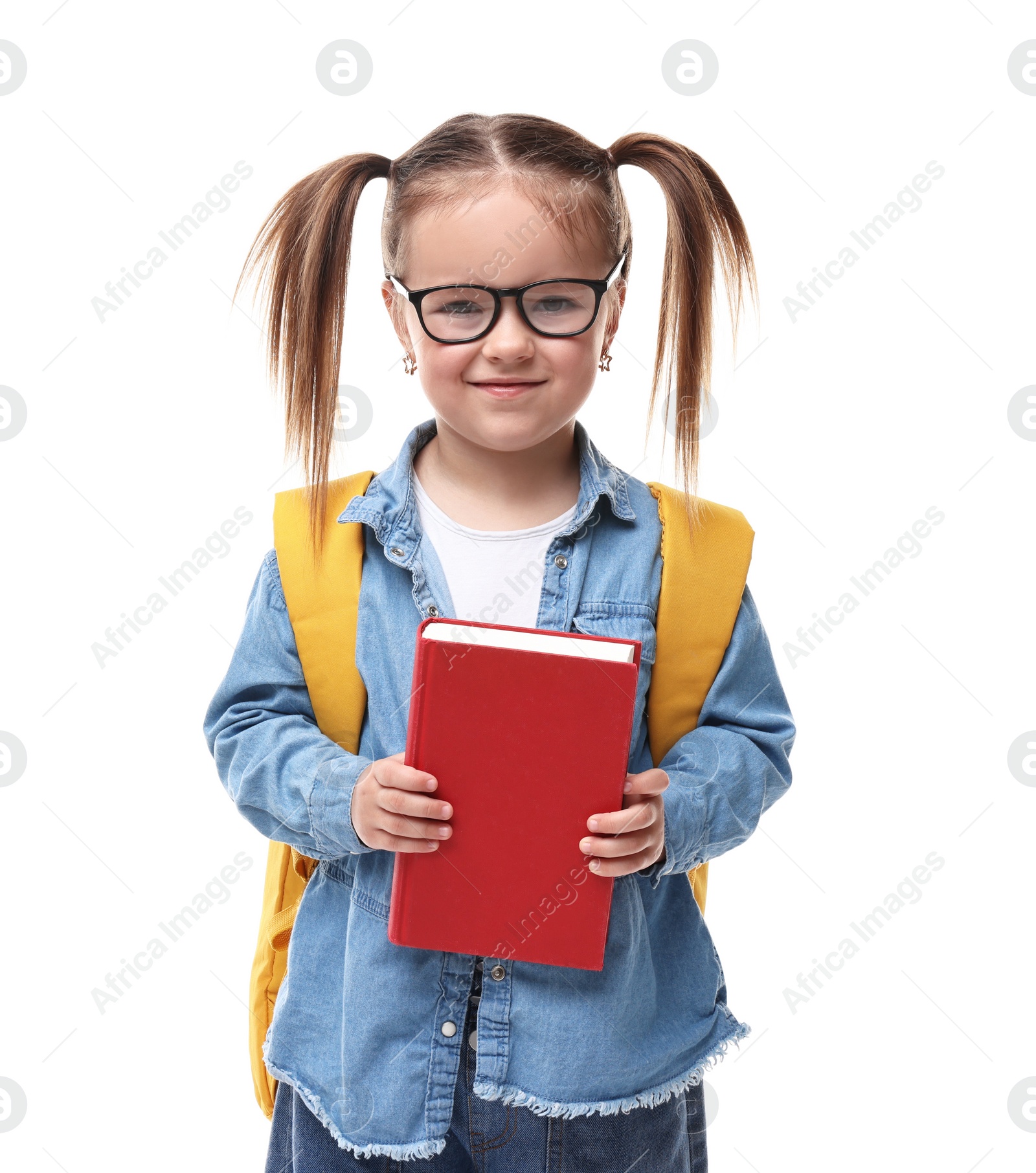 Photo of Cute little girl in glasses with book and backpack on white background